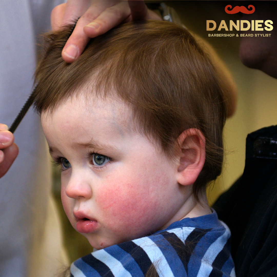 Friendly kids barber in Campbell giving a haircut