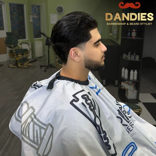 Friendly kids barber in Campbell giving a haircut